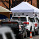 Healthcare workers from the Colorado Department of Public Health and Environment testing people for covid-19 earlier this March in Denver, Colorado